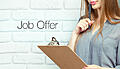 businesswoman_20with_20clipboard_20and_20pen_20making_20notes_20and_20standing_20near_20text_20-_20job_20offer_202.jpg