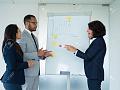 129005908-successful-trainer-teaching-new-employee-business-.jpg